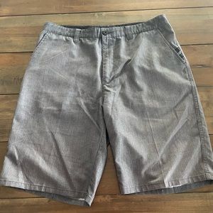 Travis Mathew pinstripe shorts.
